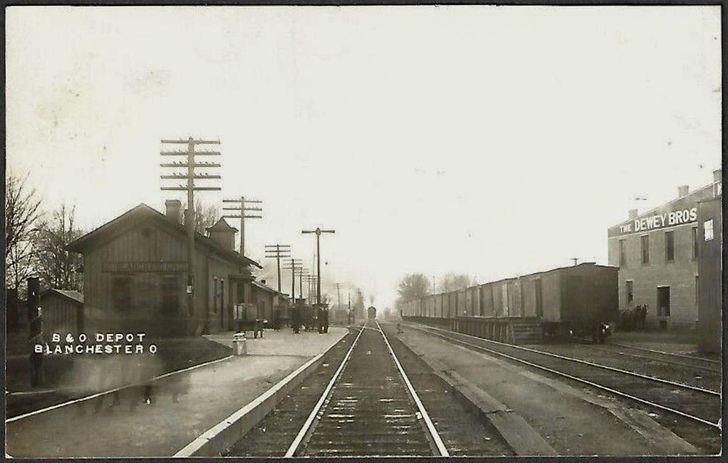 1910. B&O Railroad Depot and Dewey Brothers at Blanchester.