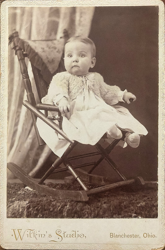 Unknown Baby In Rocking Chair. Wilkin's Studio.
