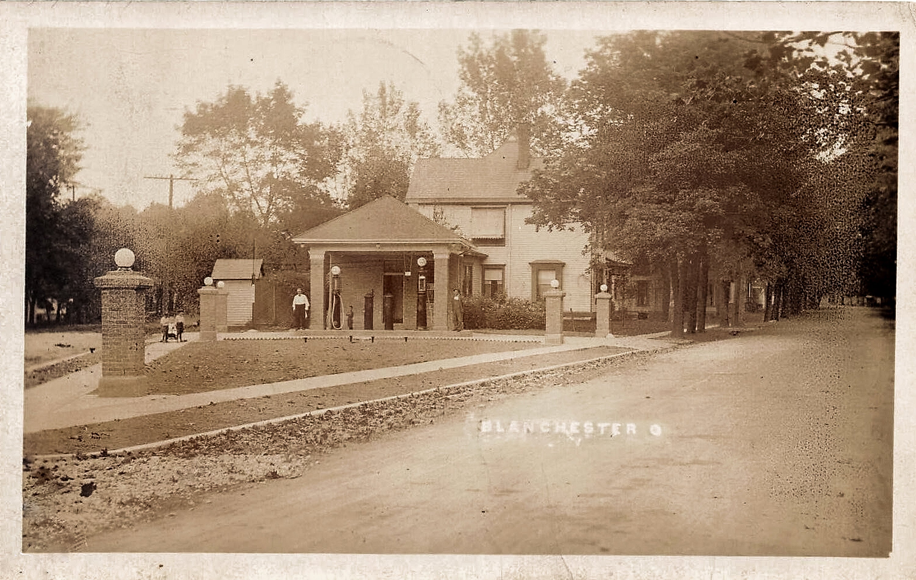 Circa 1910. Service Station at the Point at Center Street and Main Str ...